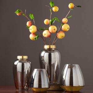 transparent glass vase with copper ring at mouth